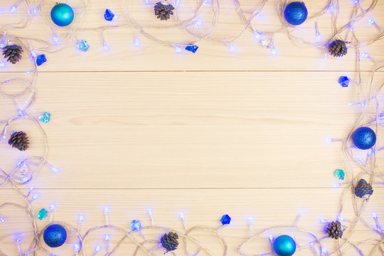 Beautiful Christmas background blue light on the table, balls
