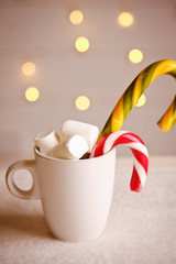 Beautiful Christmas with Cup of marshmallows and candy on bokeh background