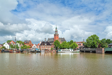 View from Leda river on City Hall and Old Weigh House in Leer, Germany