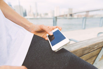 Woman using mobile phone in New york city