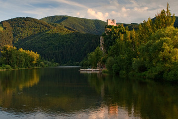 Fototapeta na wymiar Medieval castle Strecno on Vah river with raft near of town Zilina, central Europe, Slovakia