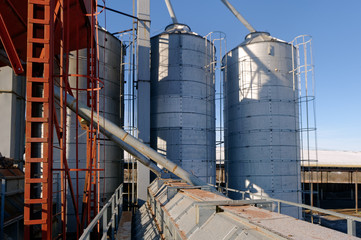 Plant for the drying of grain on the background of sky on a bright sunny autumn day