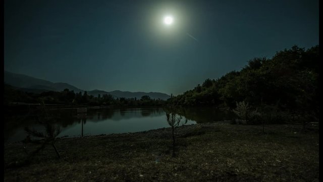 Moon over the duck lake at night Timelapse slider 