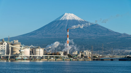 Mount Fuji and factory at Tagonoura bay, Fuji city, Japan