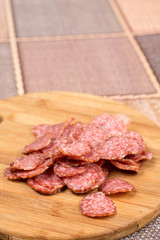 Delicious homemade domestic sausage on the wooden board