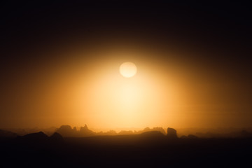 Gloomy sunset over rough ice landscape