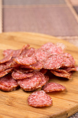 Delicious homemade domestic sausage on the wooden board
