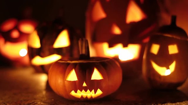 A bunch of spooky smoking halloween pumpkins