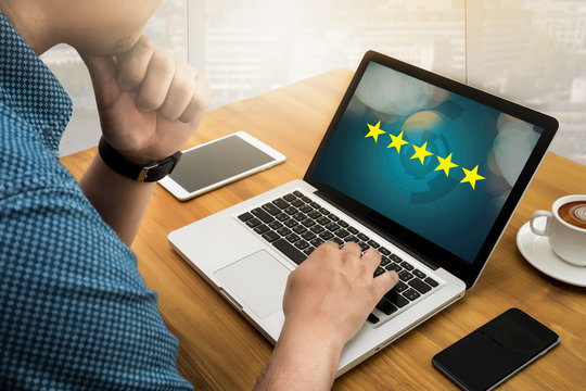 Businessman holding five star rating,Review, increase rating or