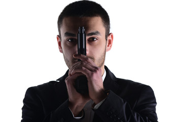  Attractive male holding gun in his hand. Assassin. Police officer. isolated on white