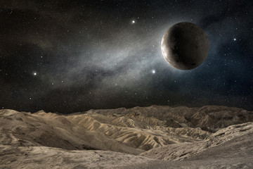 Naklejka premium moon on a desert landscape in a starry night