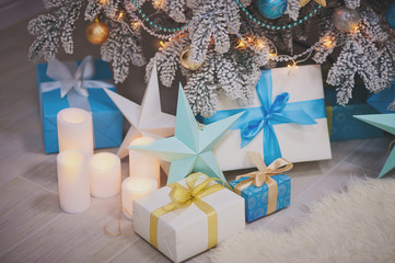 Christmas composition - the presents, candles, decorative stars