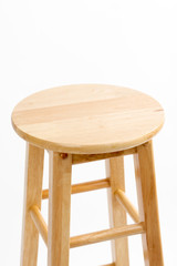 Top of the wooden bar chair isolated on white background. Wooden light pine dining stool. Natural, solid wood bench.