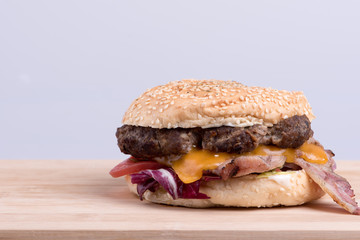 Cheeseburger on wooden board