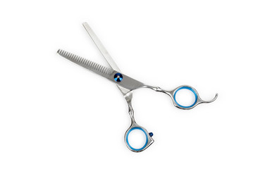 Professional haircutting scissors isolated on white background. Silver metal, stainless steel scissors.