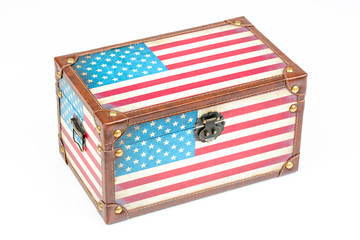 Wooden box with American flag design. USA flag on the vintage wooden box isolated, on white background. Chest with latch lock. Rectangle container with lid. Top side view.