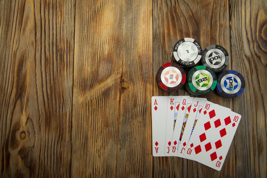 Combination of card game poker on the old wooden table