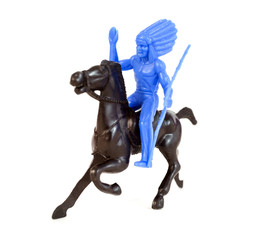 Plastic toy Indian chief on horse with headdress and spear.