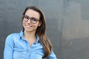 Close face of brunette female with glasses with copy space 