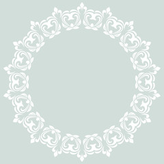 Oriental round frame with arabesques and floral elements. Floral fine border. Greeting card with place for text. Light blue and white pattern