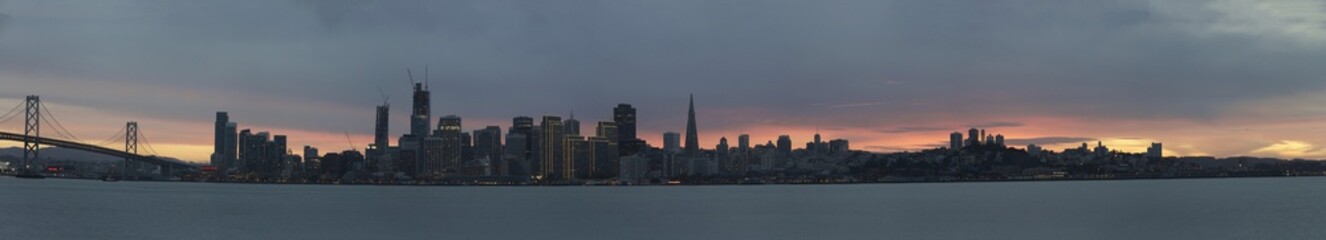 Panoramic view of San Francisco sky line at sunset. San Francisco is the cultural, commercial, and financial center of Northern California and a popular tourist destination.
