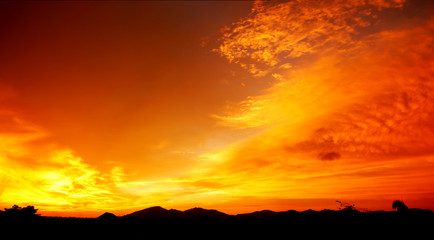 Sunset over the mountain .