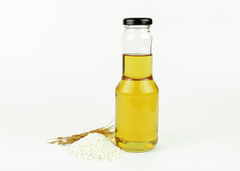 Rice bran oil in bottle glass and rice