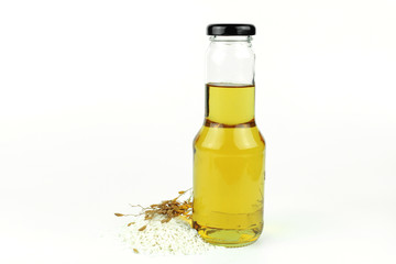 Rice bran oil in bottle glass and rice