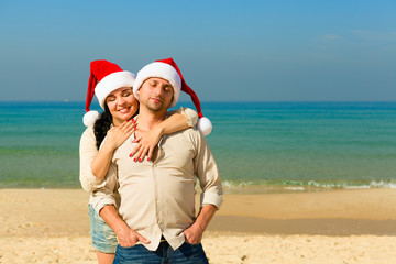 Christmas couple on a beach