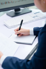 Businesswoman working at desk in office.