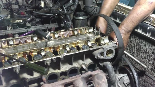 Technicians repair the old engine