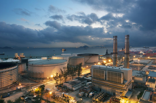 Power plant and oil tank at dusk