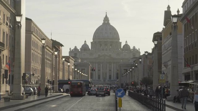 Many people and transport heading for Vatican City, famous landmark in Rome