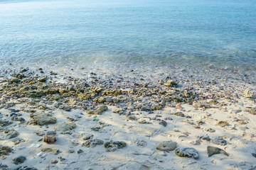 wave and rock on beach