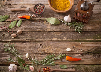 herbs and spices on a wooden background