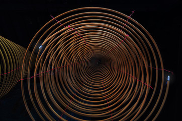 Burning incense coils at temple of Macau, handing under the temple roof