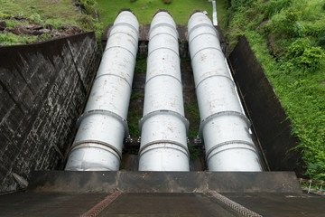 Large water pipe in a sewage treatment plant, with digestion tan