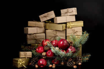Christmas and New year. Apples with pine cones, nuts in  basket with fir branches.