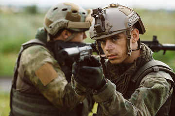 Portrait of a ranger in the battlefield with a gun