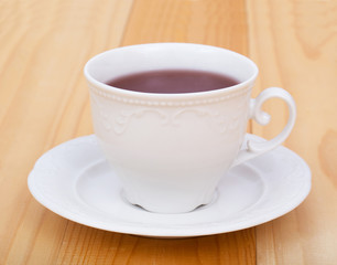 tea and macaroon on white
