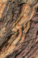 Multi-colored stone with lines and cracks