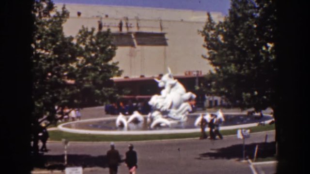 1939: A Courtyard In Front Of A Building, With A Statue In A Pool, With A City Bus Driving By NEW YORK WORLDS FAIR