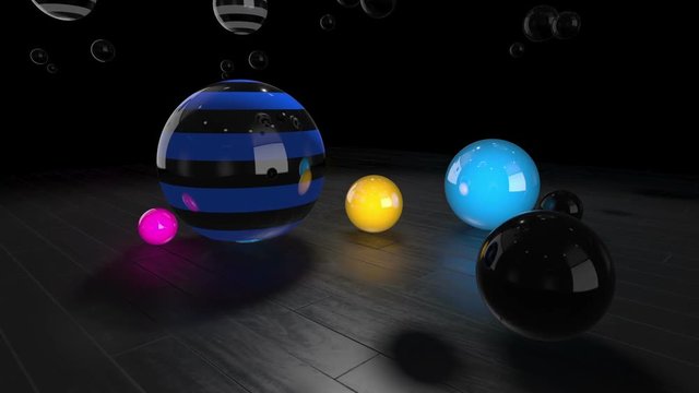 Colorful Reflective Spheres Slowly Rotating On A Wooden Floor