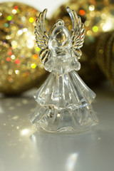 Crystal Angel on the background of Christmas balls. new Year decoration. Christmas ornaments, christmas decoration