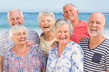 Portrait of senior friends at the beach