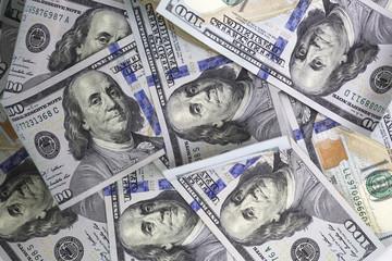 Mixed in the same plane hundred us dollar bills. Background.