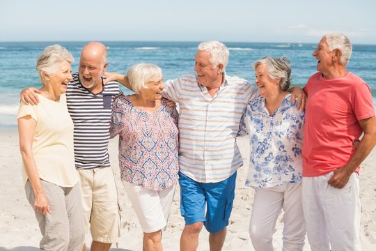 Portrait Of Senior Friends At The Beach