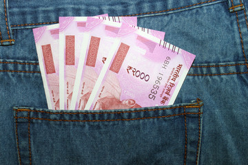 New 2000 rupee notes in an Indian mans jean back pocket.