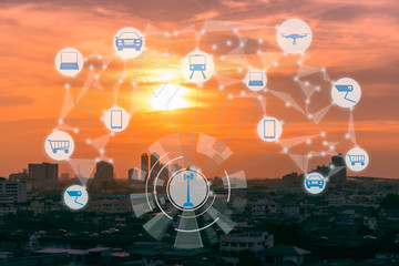 Fototapeta na wymiar Internet of Things and Smart city concept. Smart things icons mesh on city traffic at twilight background.