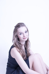 Fototapeta premium Mädchen sitzend im Studio 